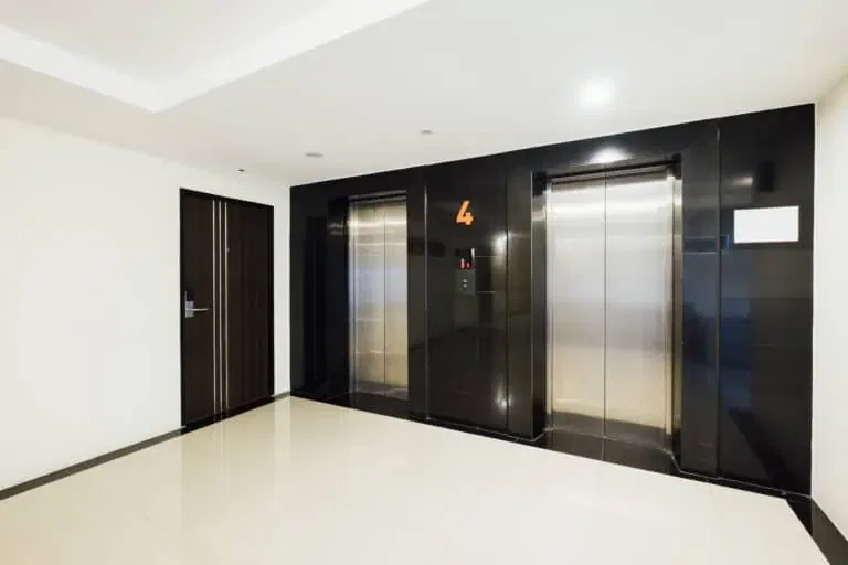 Elevator area in a California public building that may fail ADA height and signage standards