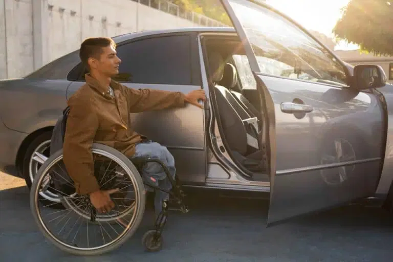 full shot man wheelchair near car 1