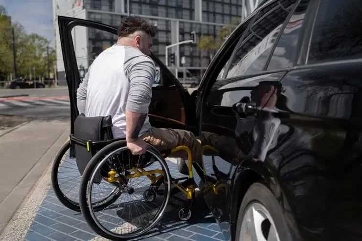 full shot man wheelchair near car 23 2149445684