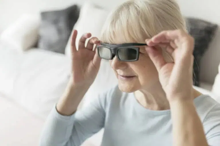 woman adjusting 3d glasses while watching film