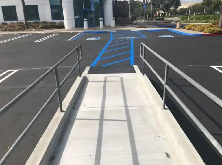 repaving school parking lot with handicap parking stenciling