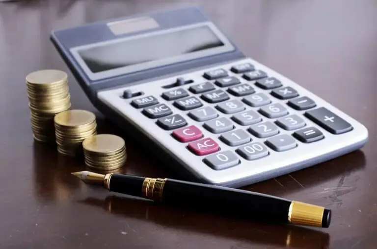 vecteezy fountain pen and calculator and coins stack on wooden table 2384610 1