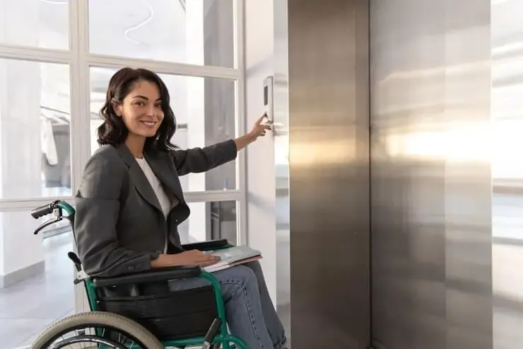woman sitting wheelchair pushing sensor button call elevator office 259150 80514