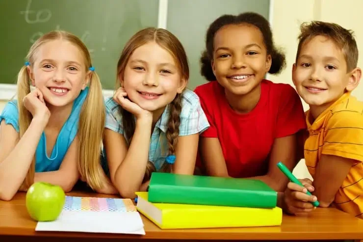 cheerful schoolchildren with blackboard background 1098 3943