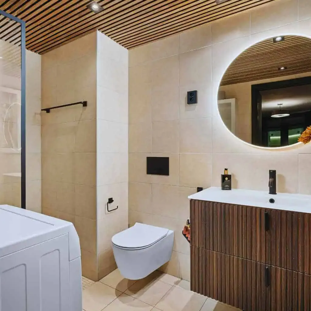 Accessible Bathroom Layout with Grab Bars and Wall Mounted Sink